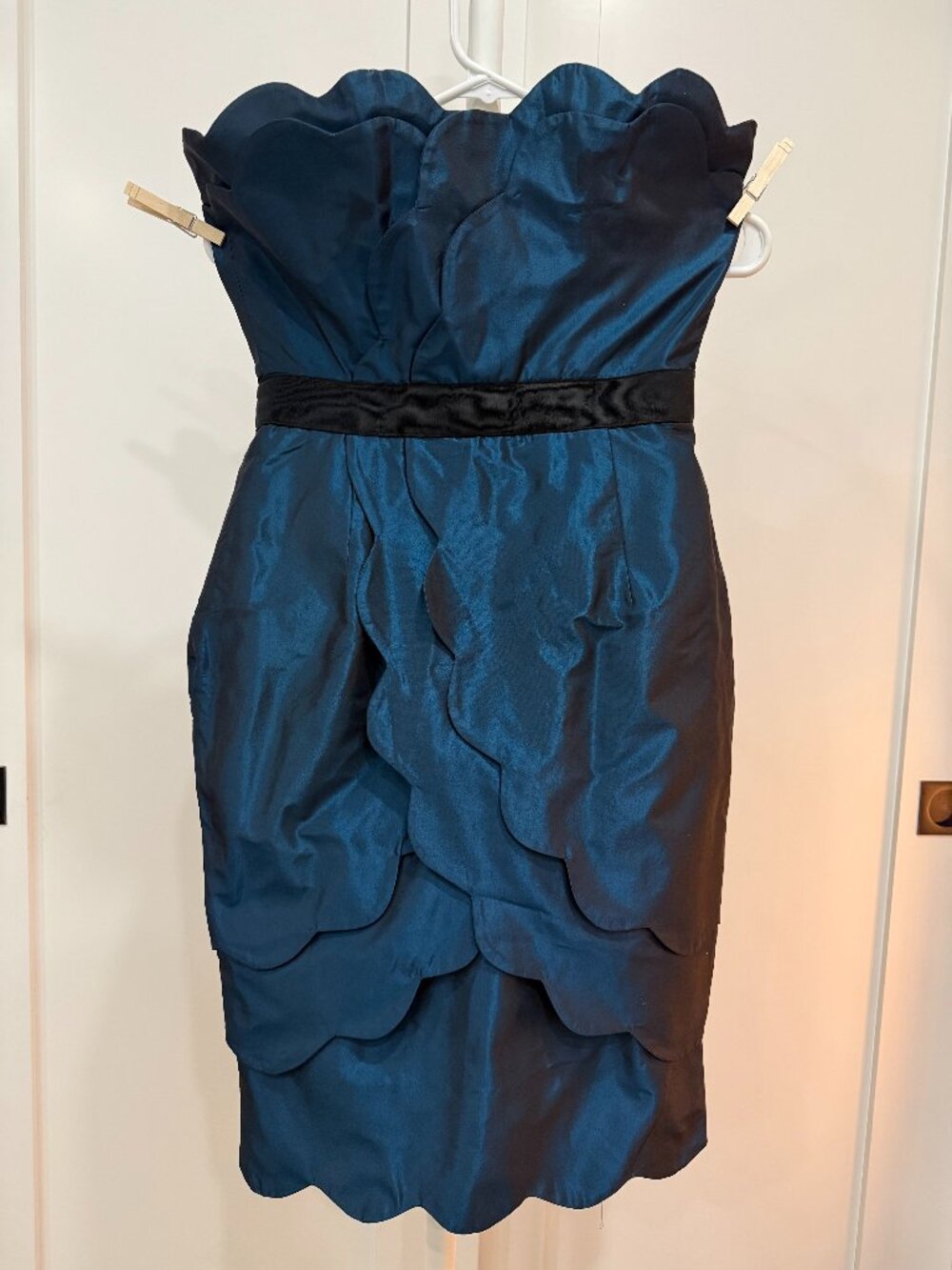 A Whimsical, fairytale-inspired cocktail dress with beautiful scalloped details.
